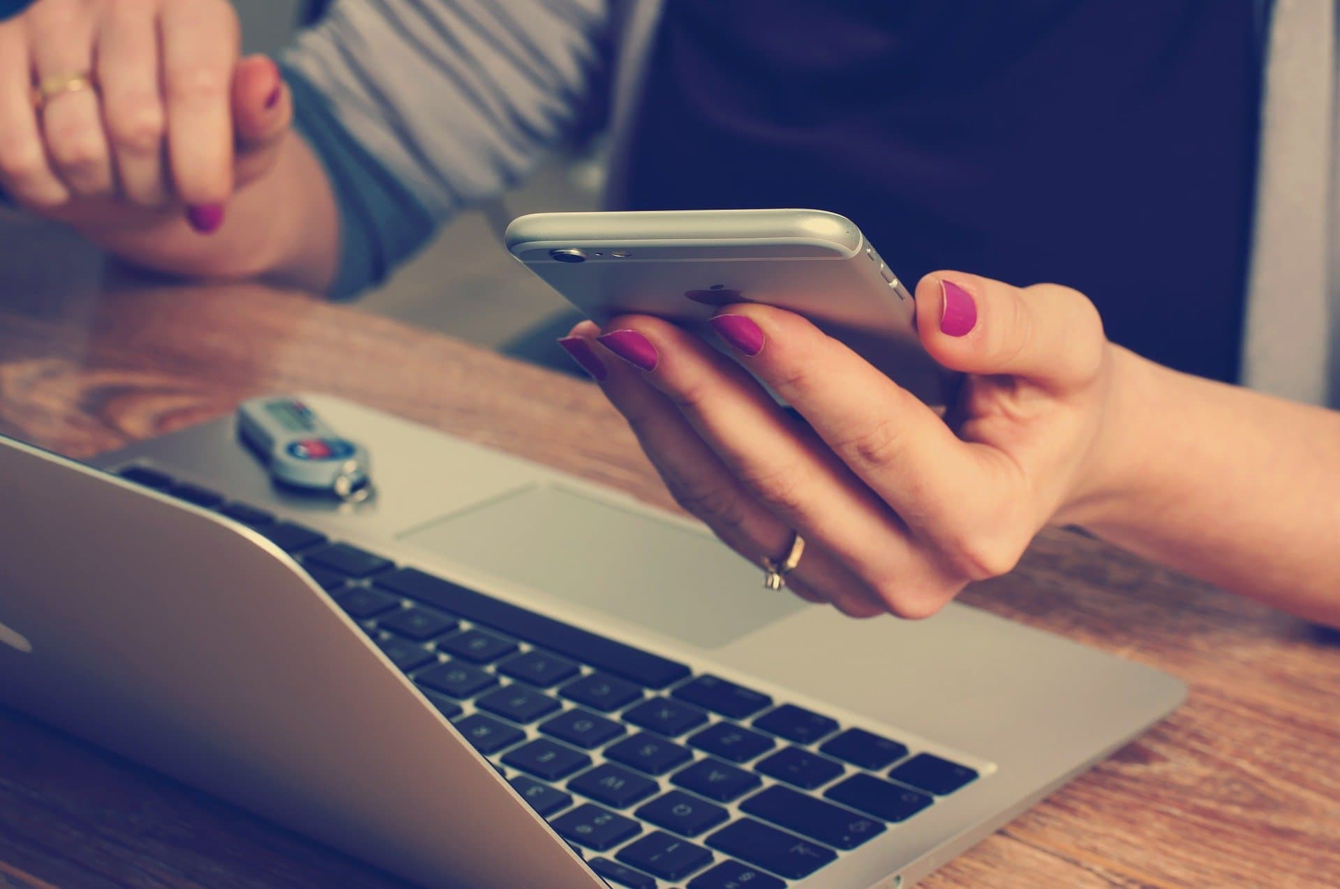 woman on laptop and mobile device